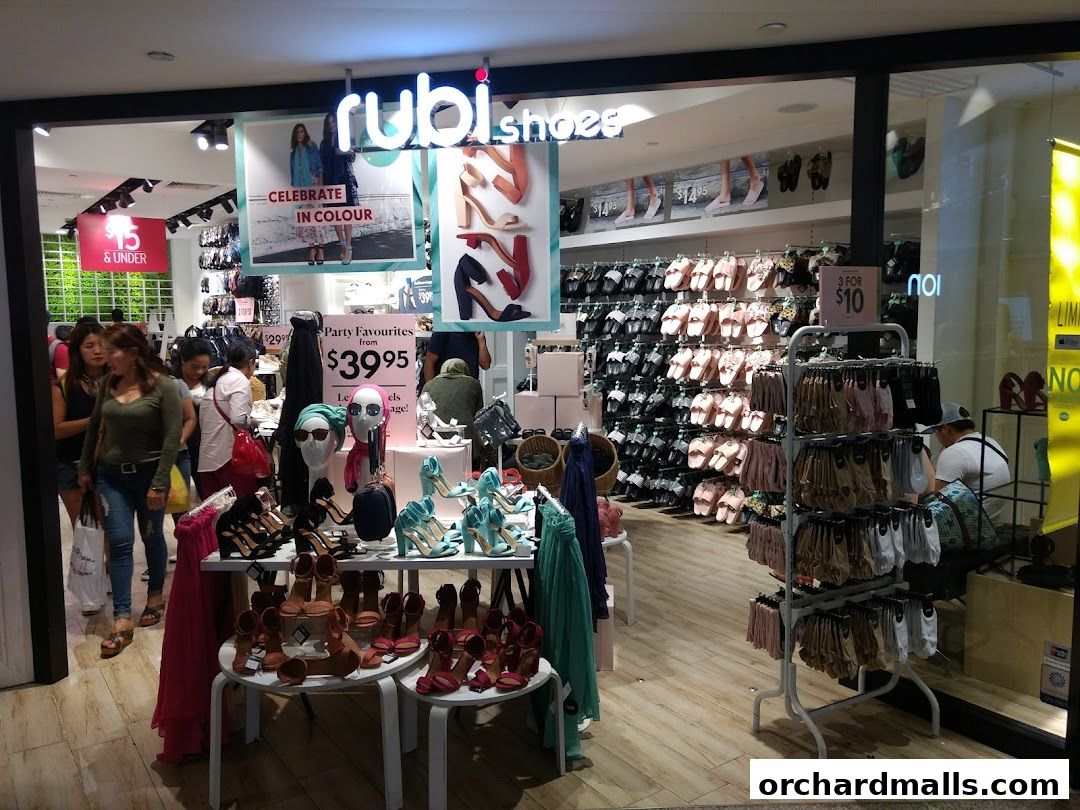 Interior view of Rubi Shoes store showcasing a wide variety of sandals, heels, and accessories.