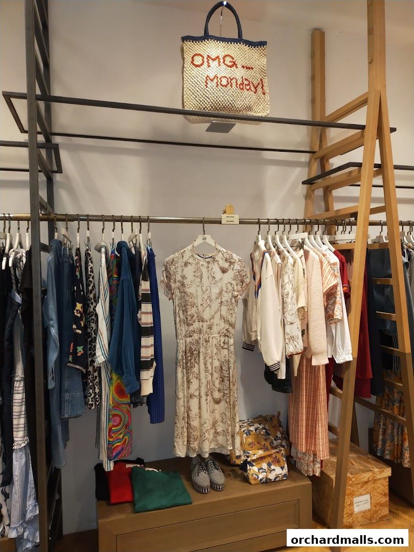 A display of women's clothing and accessories in a boutique setting.