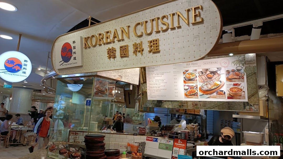 A view of Rui Feng Korean Cuisine restaurant with its signage and menu displayed.