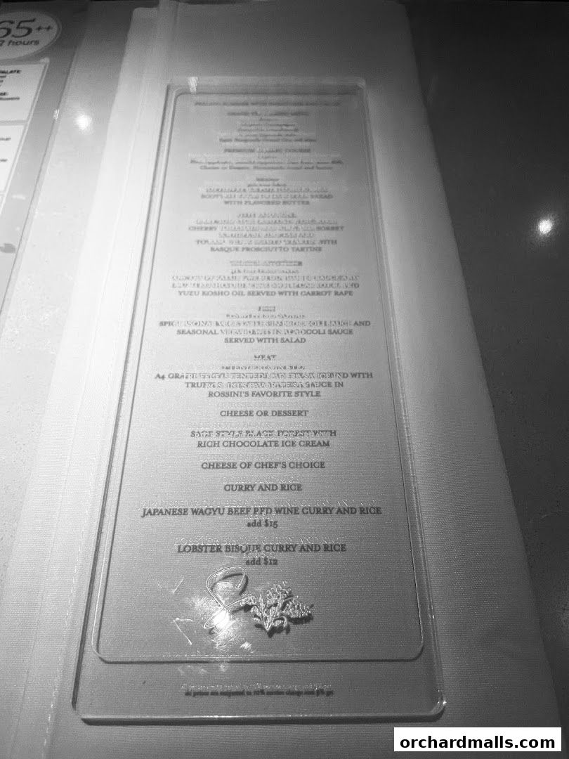 A close-up of a restaurant menu with various dishes and prices listed.