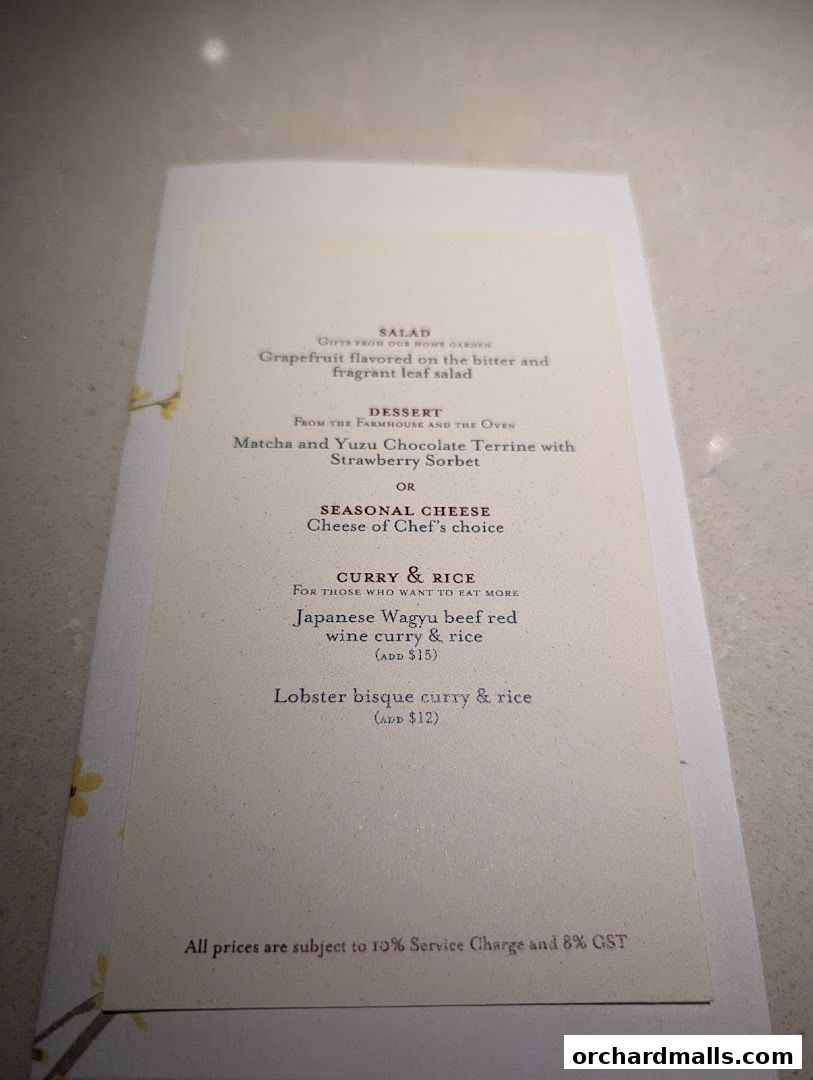 A menu from Sage by Yasunori Doi featuring salads, desserts, and curry dishes.