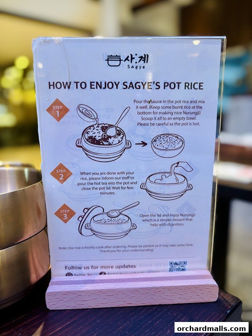 A sign explaining how to enjoy Sagye's Pot Rice with illustrated steps.