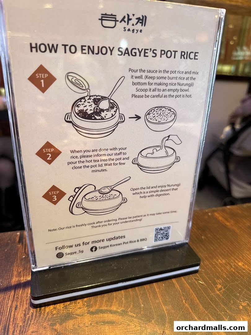 A sign explaining how to enjoy Sagye's Pot Rice with illustrated steps.