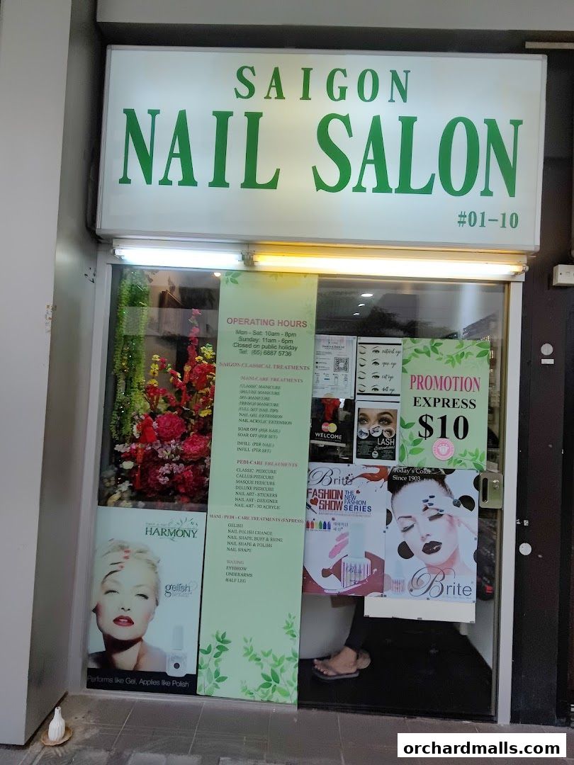 Exterior of Saigon Nail Salon with signage, operating hours, and service promotions displayed.