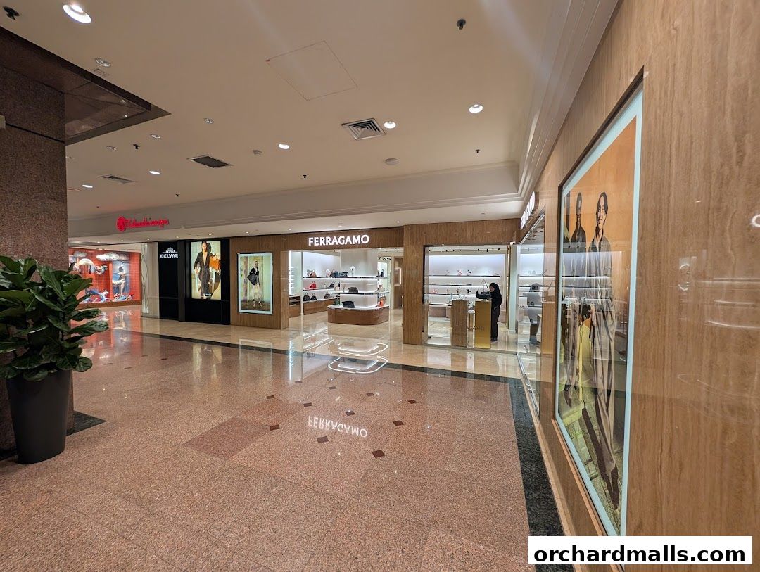 Exterior view of the Salvatore Ferragamo store with displays of luxury goods.