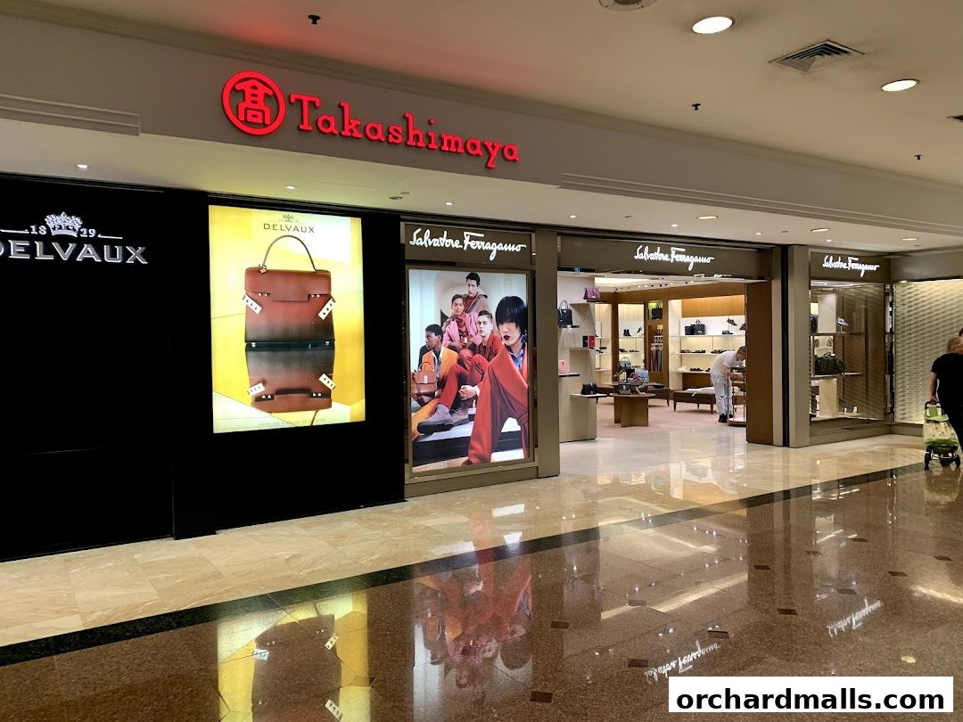 Exterior view of Salvatore Ferragamo and Delvaux shops within a mall.