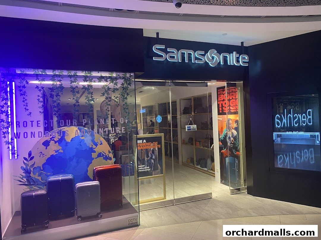Samsonite store front with luggage displays and a globe graphic in the window.