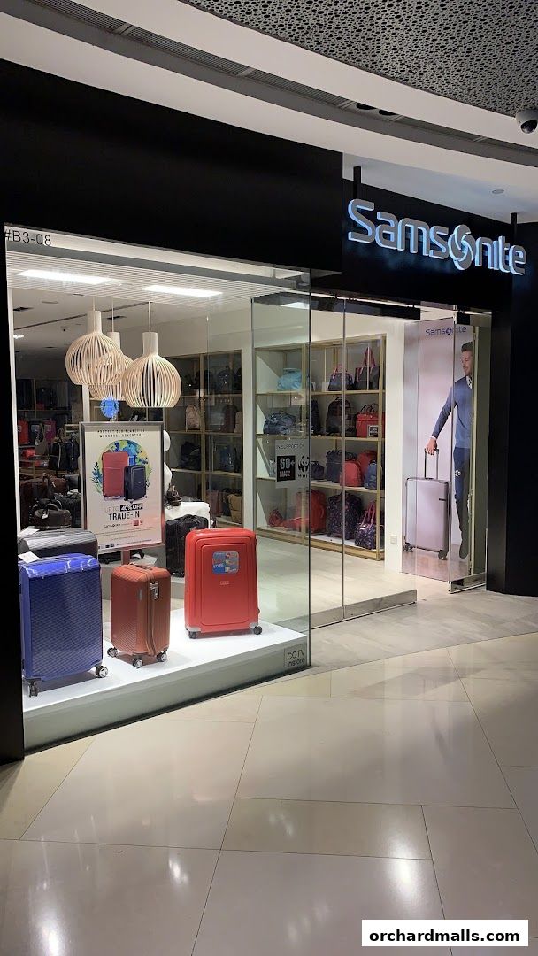 Samsonite store front with luggage displays and promotional posters.