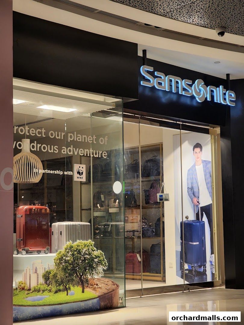 Samsonite store front with luggage displays and a promotional poster.