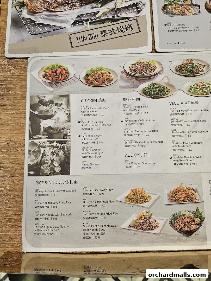 A menu featuring Thai BBQ dishes, including chicken, beef, vegetables, and rice/noodle options.