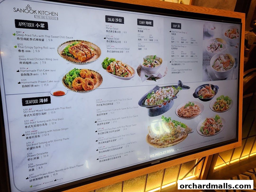 A digital menu board displaying Thai dishes with prices and images.