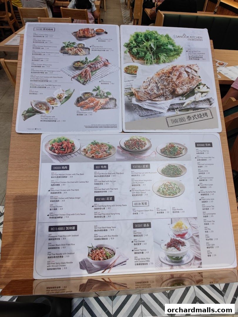 A menu from Sanook Kitchen Thai BBQ & Seafood featuring various Thai dishes and beverages.