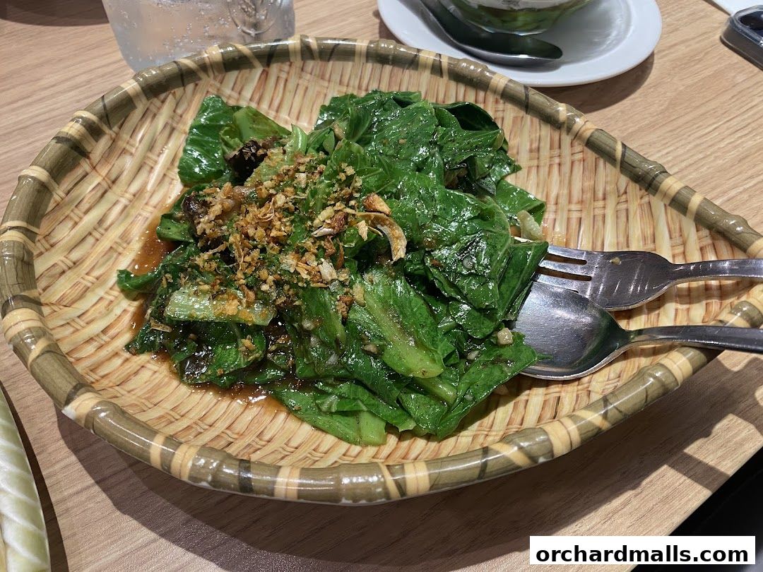 A close-up shot of a delicious stir-fried vegetable dish served in a woven basket.