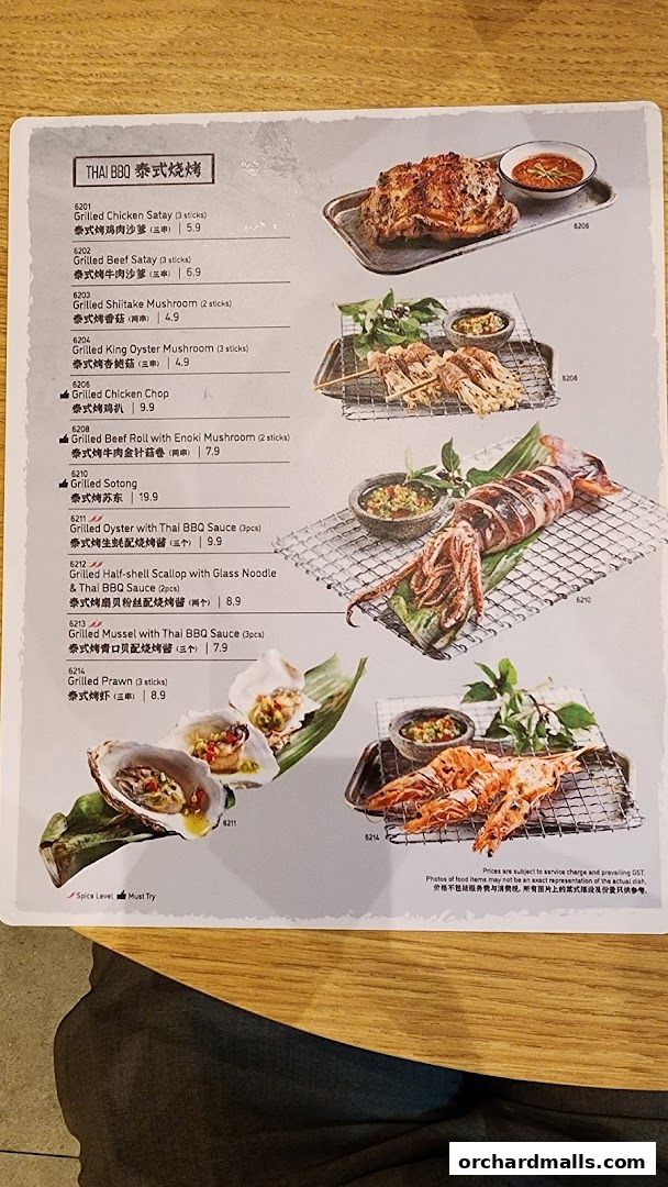 A menu page showcasing various grilled Thai BBQ seafood and meat dishes with prices.