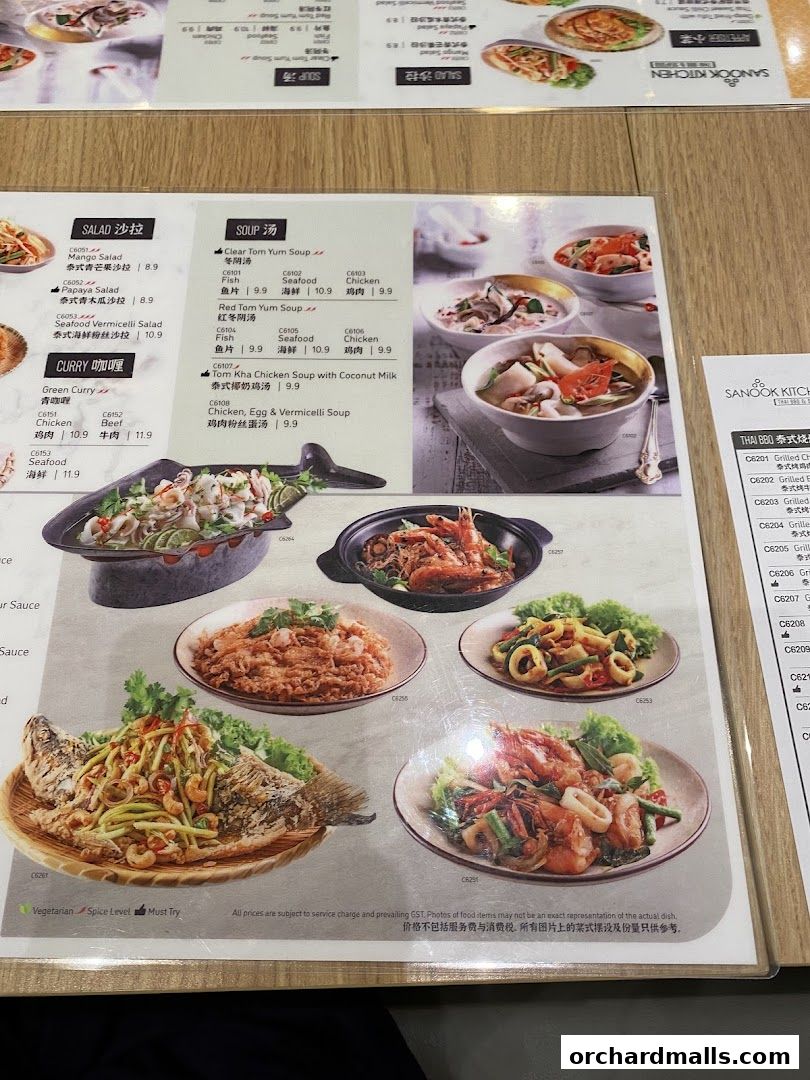 A menu from Sanook Kitchen Thai BBQ Seafood featuring various Thai dishes with prices.