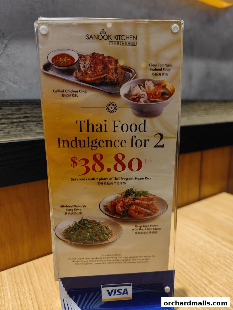 A menu board for Sanook Kitchen Thai BBQ & Seafood, featuring a 'Thai Food Indulgence for 2' set.