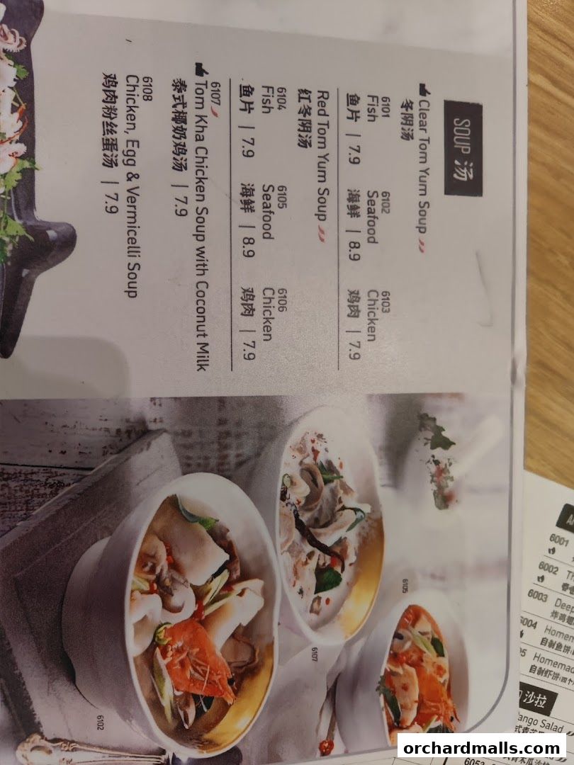 A menu page from Sanook Kitchen featuring various Thai soups with images.