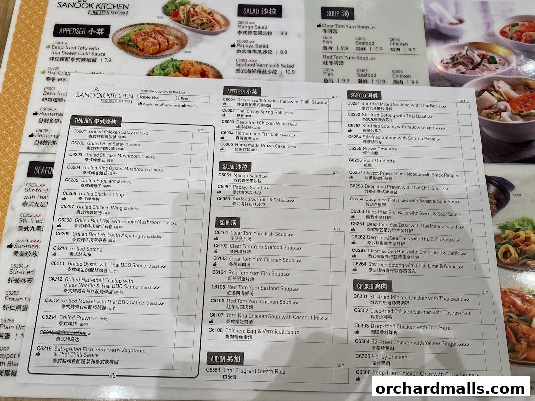 A menu for Sanook Kitchen Thai BBQ & Seafood with various Thai dishes and seafood options.