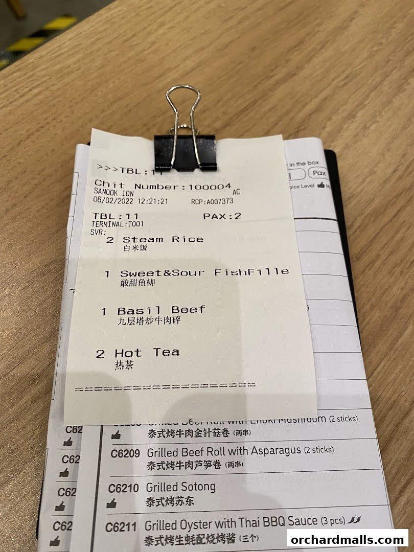 A receipt from Sanook Kitchen showing ordered items like Steam Rice, Basil Beef, and Hot Tea.