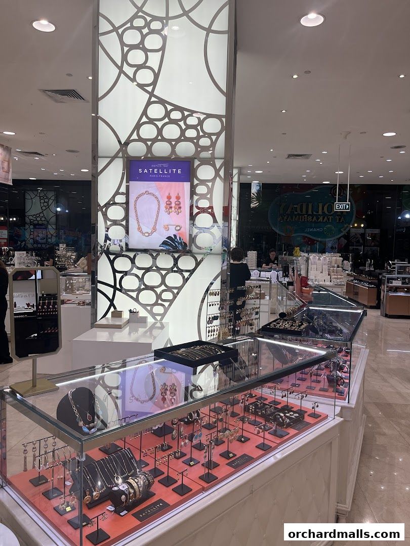 A display of elegant jewelry at Satellite Paris in Takashimaya Department Store.