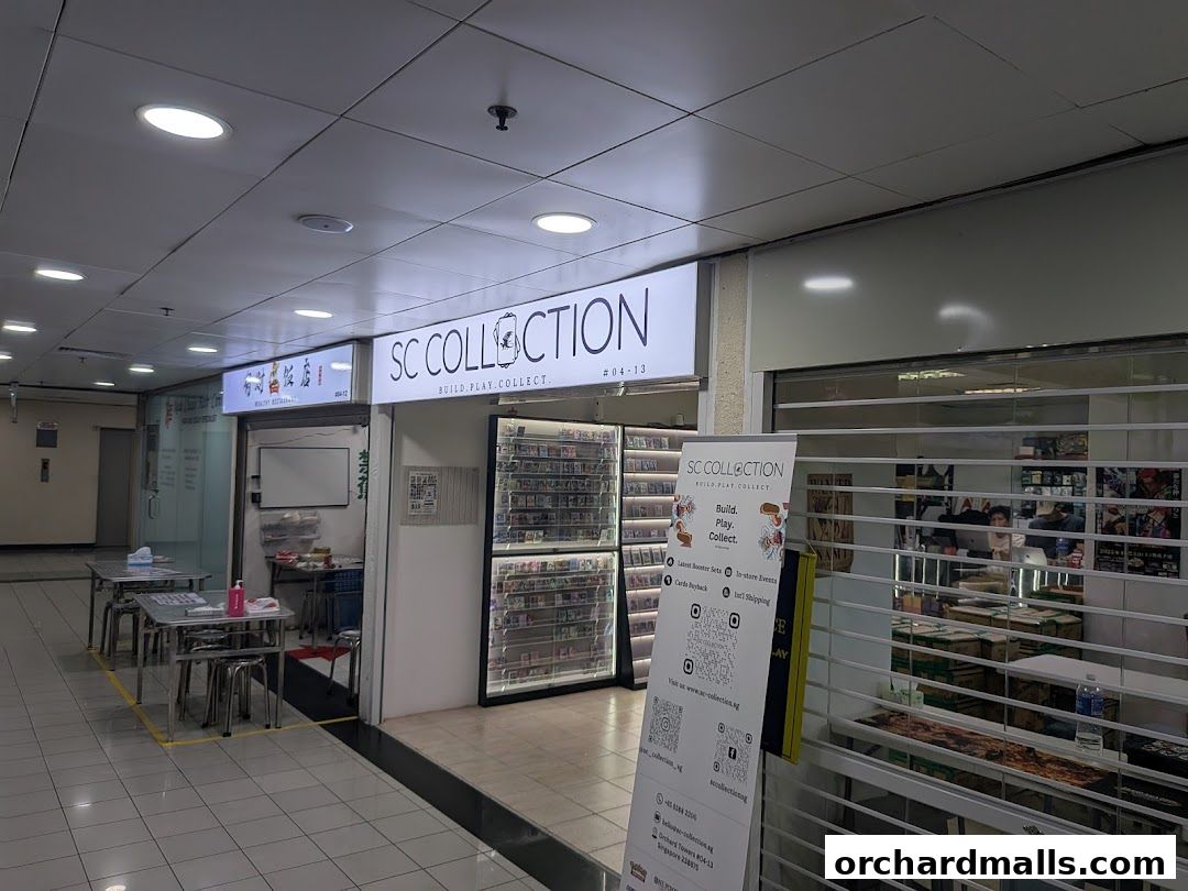 The exterior of SC Collection, a shop selling collectibles, with display shelves and a promotional banner.