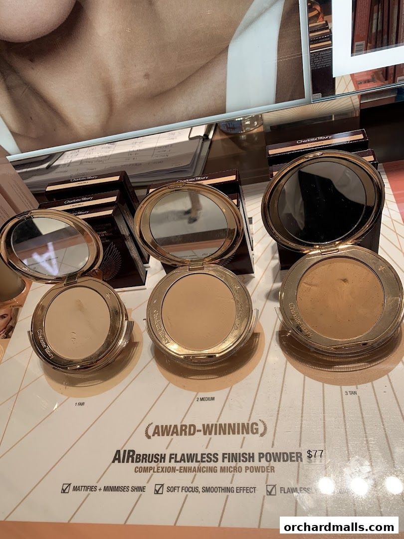 Three Charlotte Tilbury Airbrush Flawless Finish powders displayed with shade names and price.