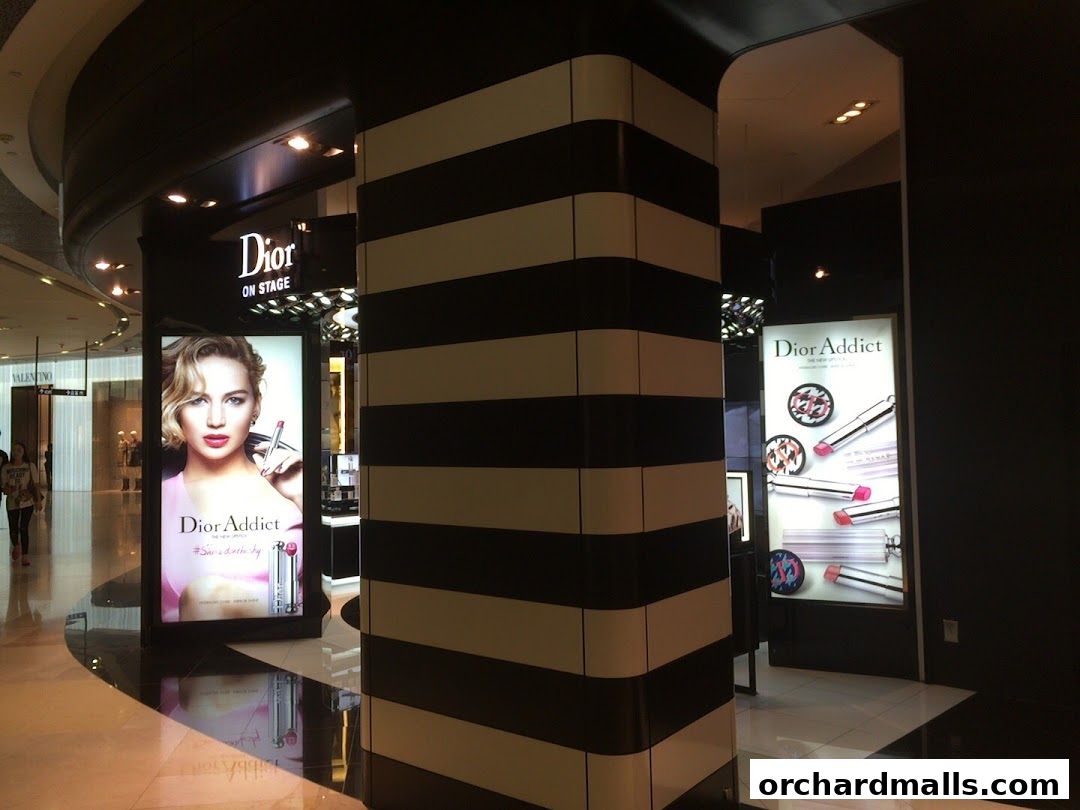 Sephora store entrance with Dior Addict makeup displays and a model.