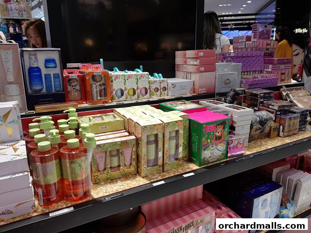 A wide selection of beauty products and gift sets displayed on shelves in a retail store.