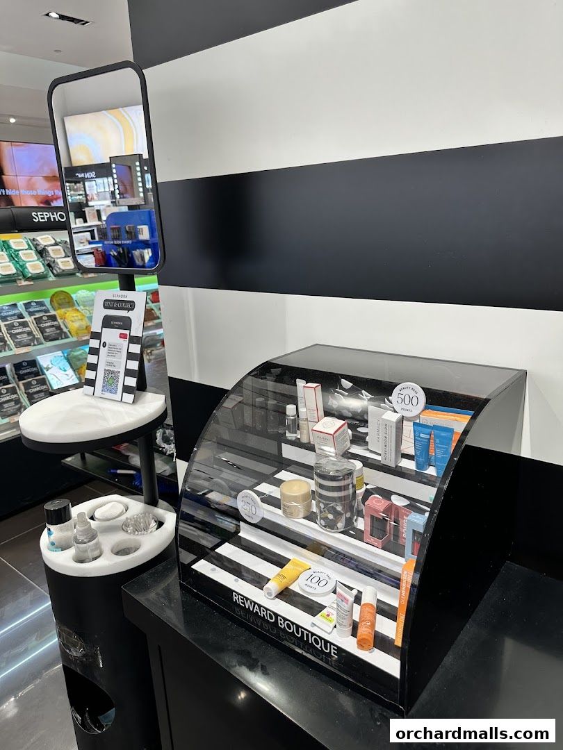 A display of skincare products at Sephora, featuring a mirror and promotional signage.