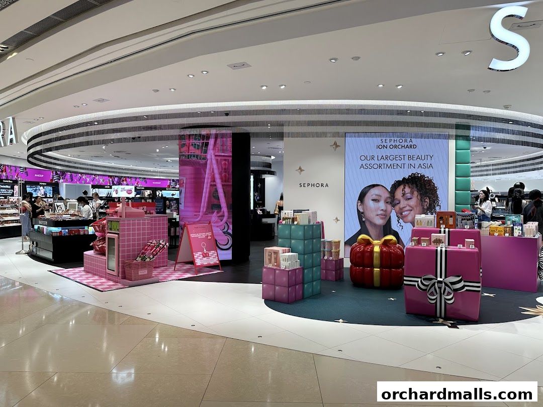 Sephora store interior with beauty products, gift displays, and promotional signage.