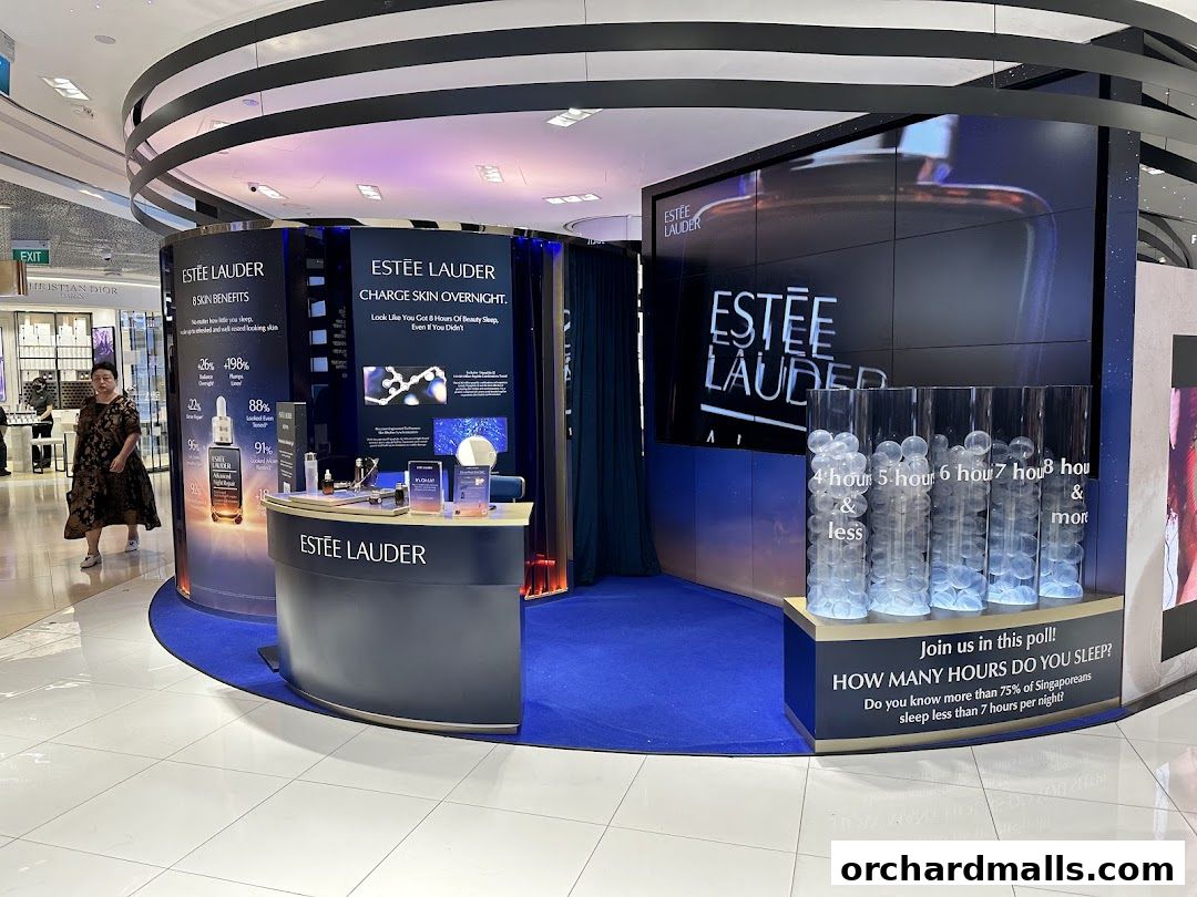 Estee Lauder beauty counter with product displays and a sleep poll.