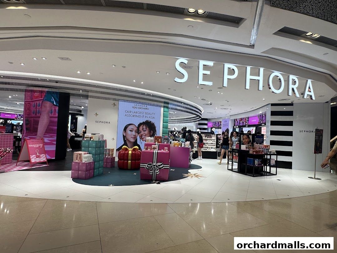The entrance of a Sephora store with its prominent signage and displays of beauty products.