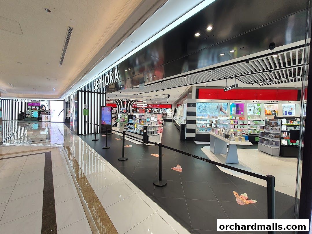 Interior view of a brightly lit Sephora store with various beauty products on display.