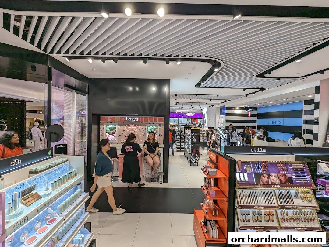 Interior view of a Sephora store showcasing makeup displays and customers.