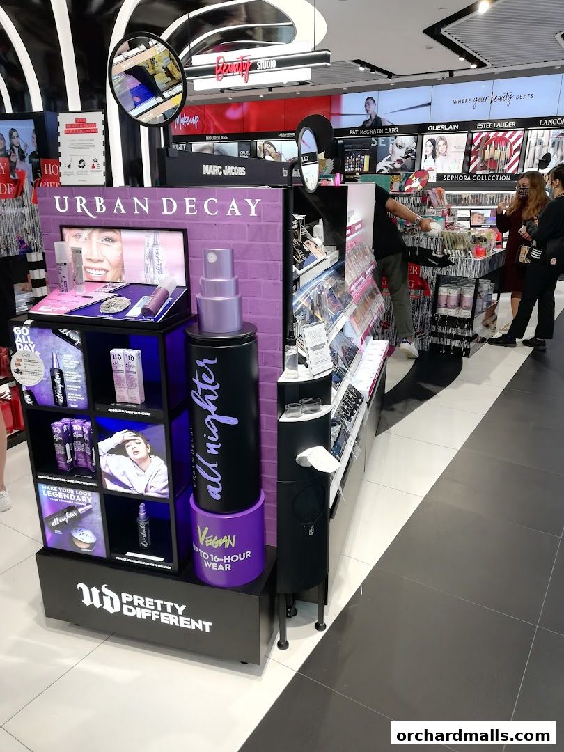 Sephora store interior featuring Urban Decay makeup display and various beauty brands.