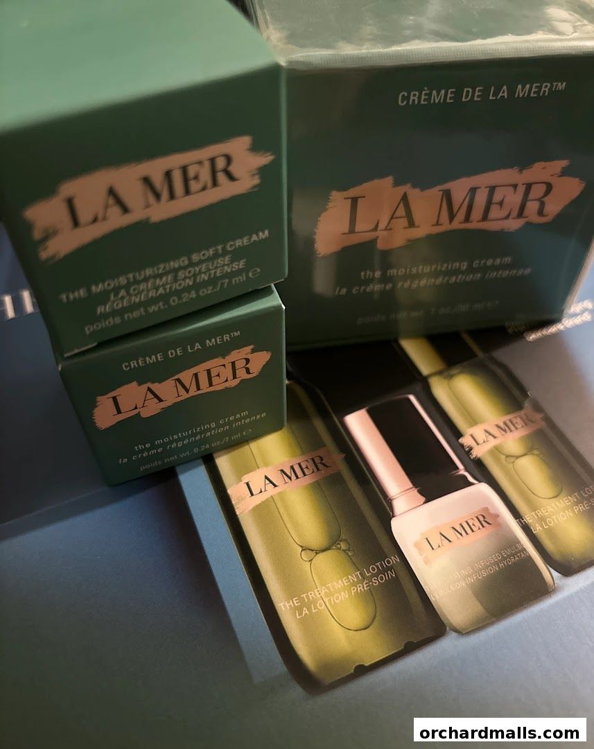 La Mer skincare products including creams and lotions are displayed.