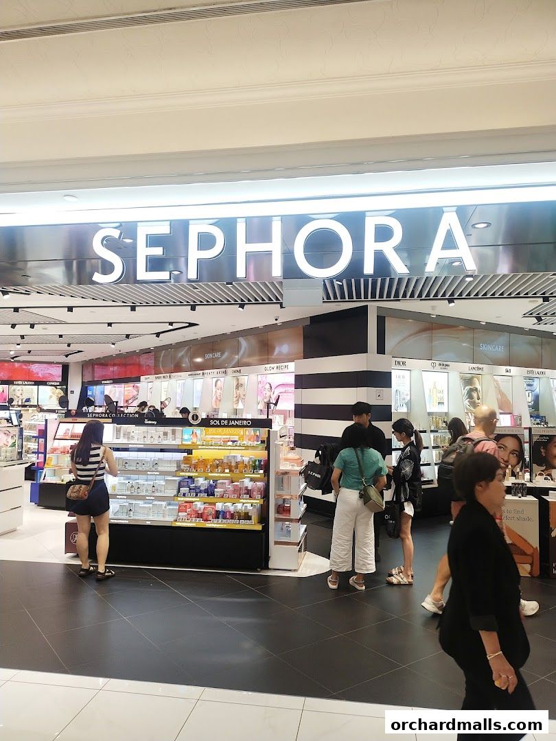 Sephora store interior with customers browsing beauty products and displays.