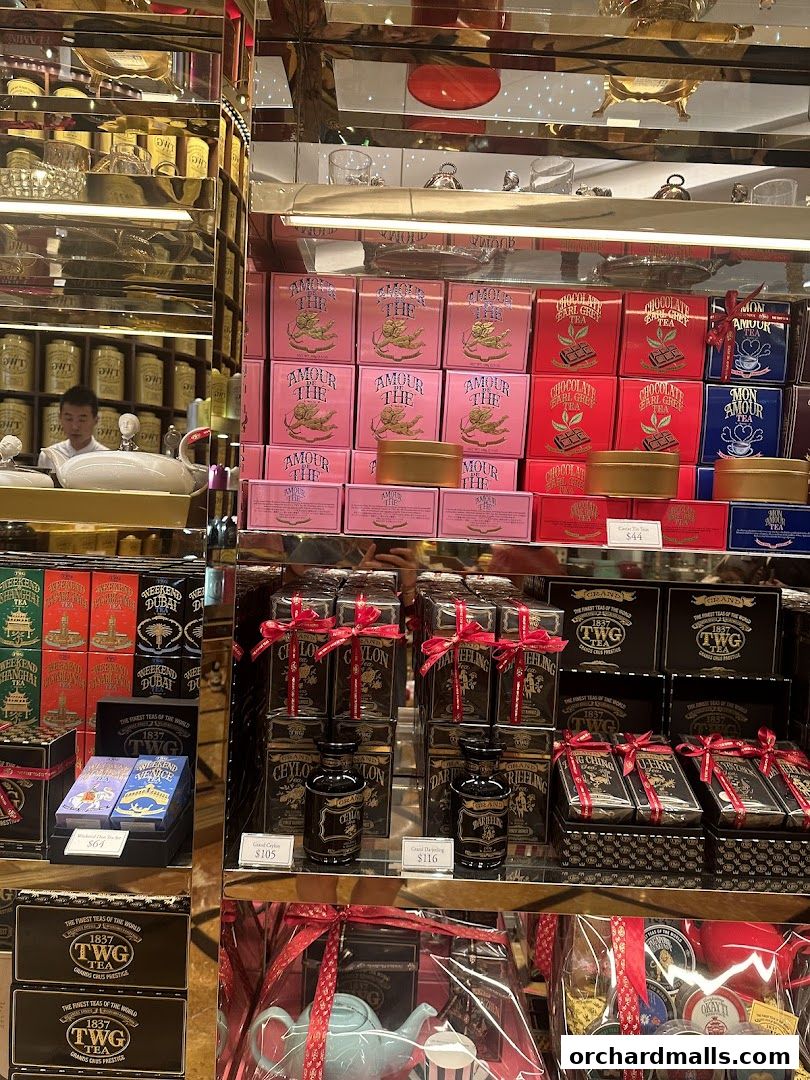 A display of various TWG teas and gift sets, including tea tins and teapots.