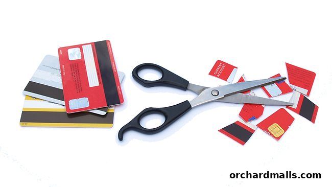Scissors cutting credit cards, symbolizing debt relief and financial freedom.