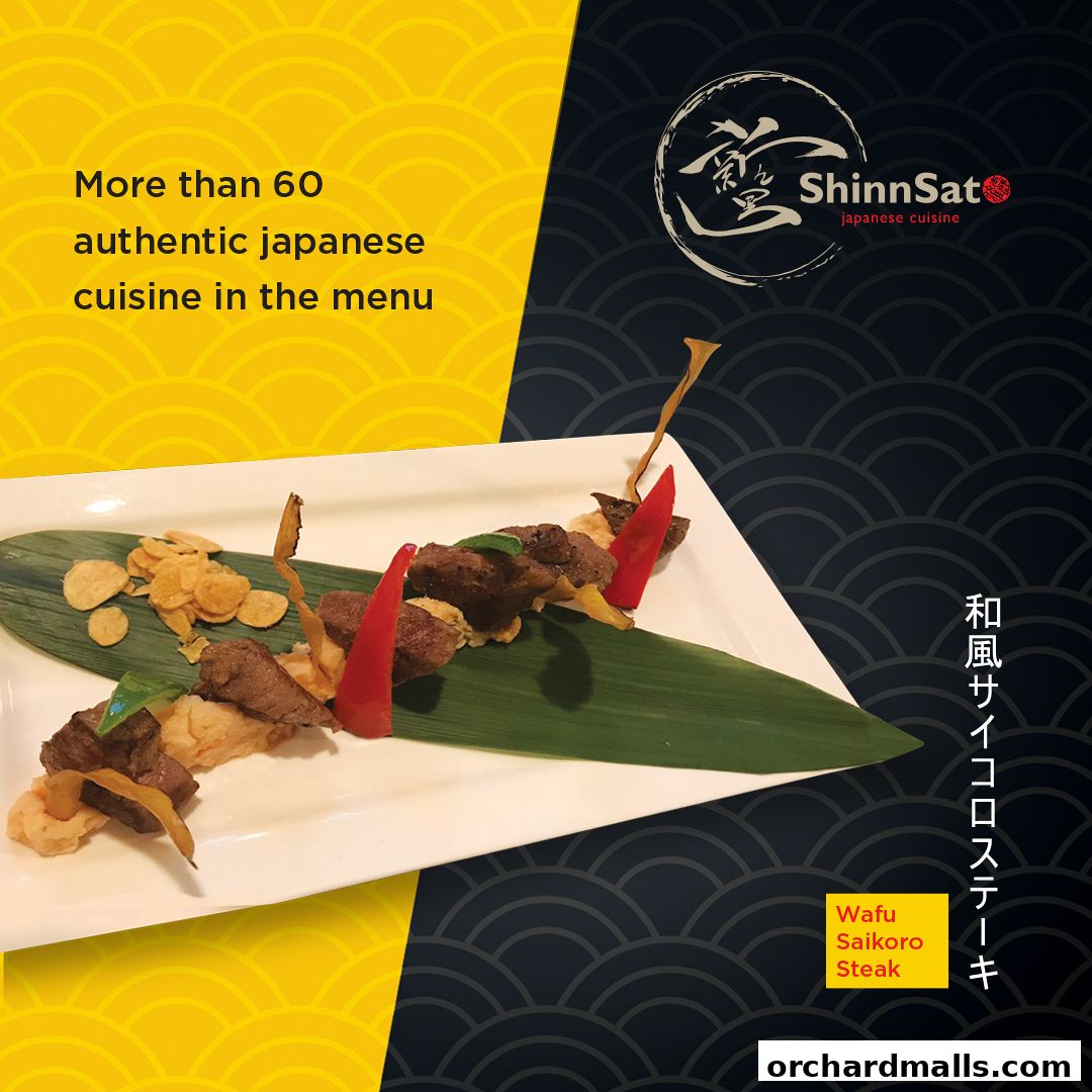 A plate of Wafu Saikoro Steak with garnishes, presented by ShinnSat Japanese Cuisine.