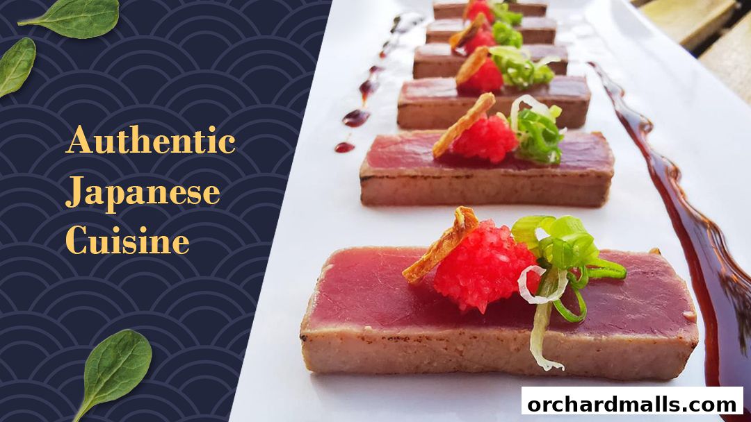 Seared tuna slices with red roe and green onions on a white plate.