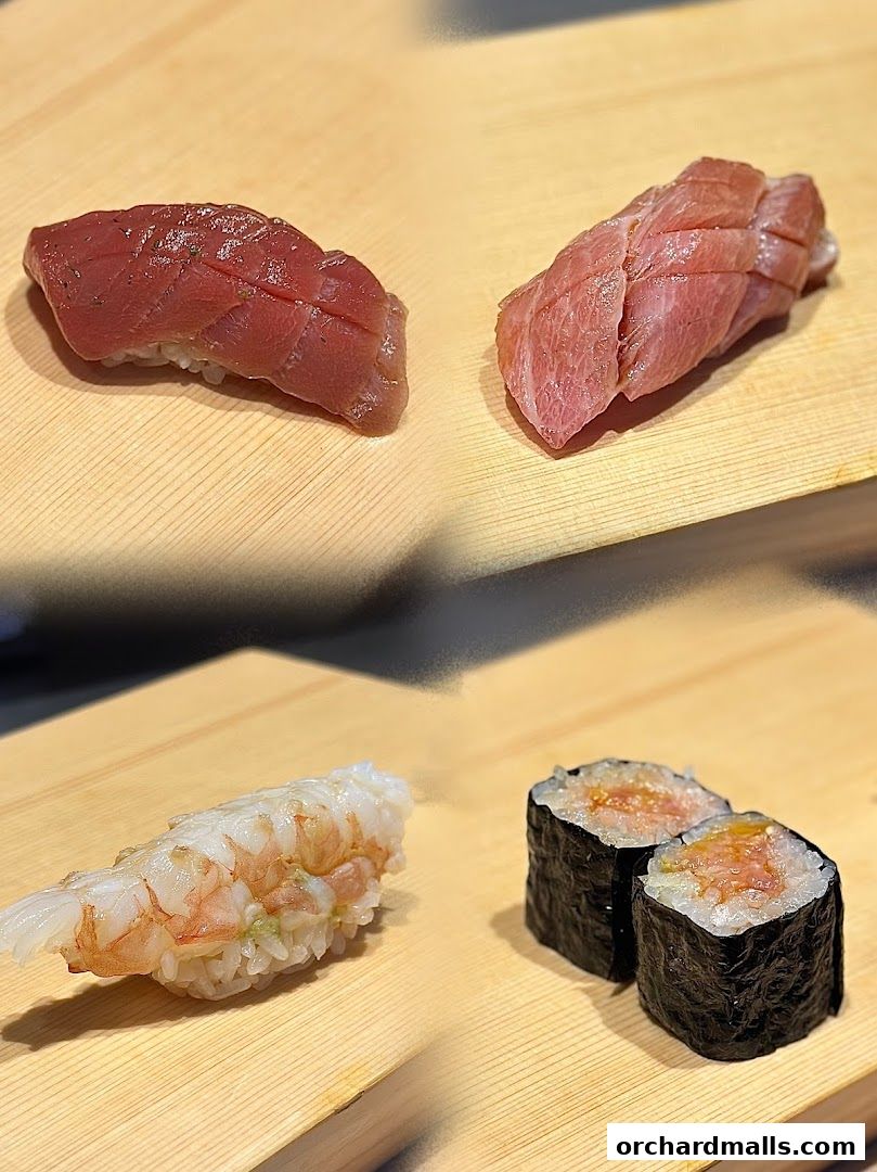 Assortment of fresh sushi pieces, including tuna and shrimp, presented on wooden boards.