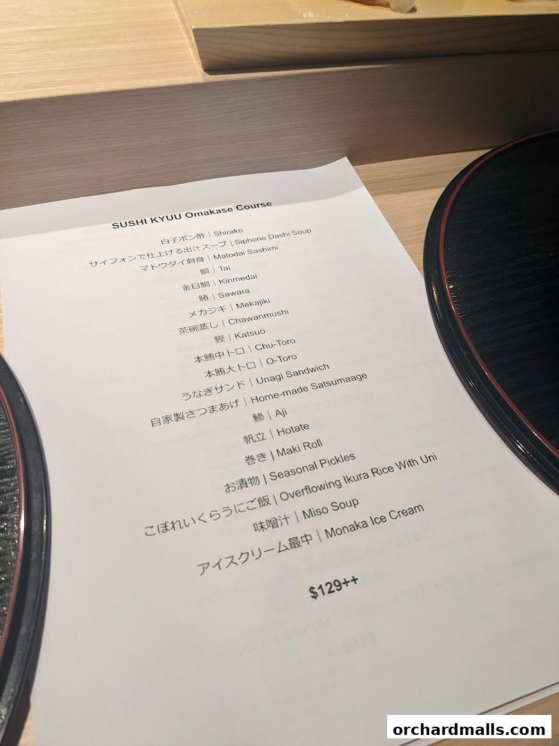 A menu for Sushi Kyuu Omakase Course with various sushi and Japanese dishes.