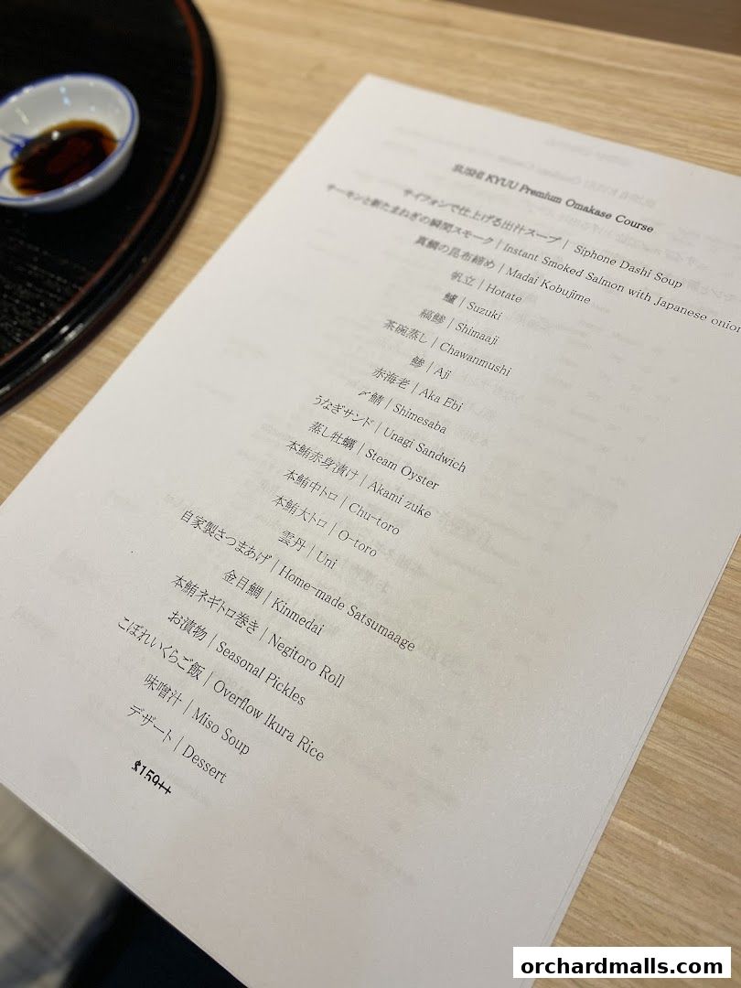 A menu for Sushi Kyuu's Premium Omakase Course with various sushi and side dishes.