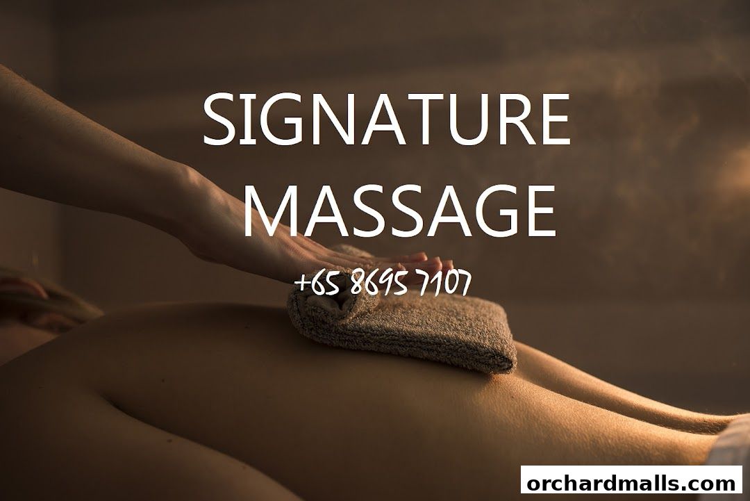 A hand giving a massage with a towel on a person's back.