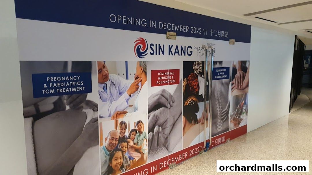 A shop front display for Sin Kang TCM Clinic, announcing their opening in December 2022.