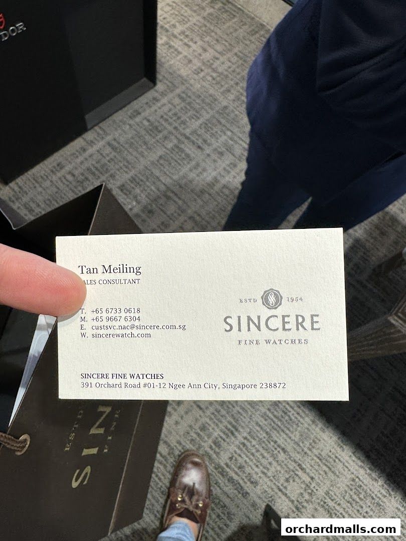A business card for Sincere Fine Watches, a luxury watch retailer.