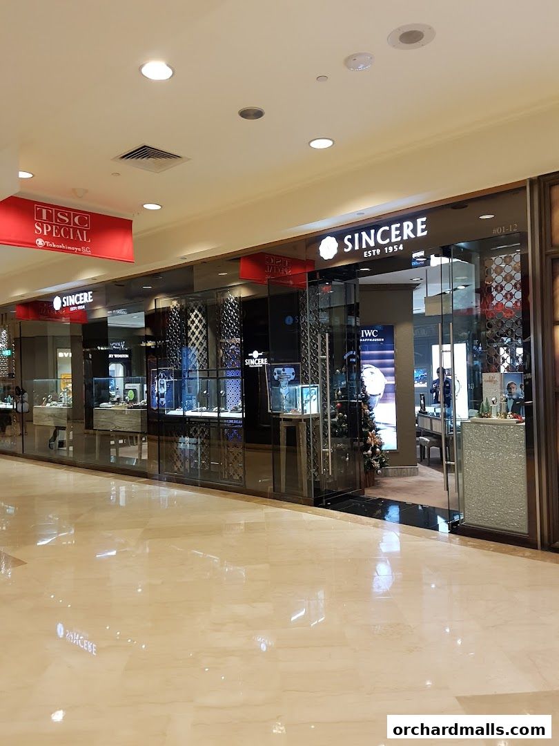 Exterior view of Sincere Fine Watches, a luxury watch retailer, with display windows.