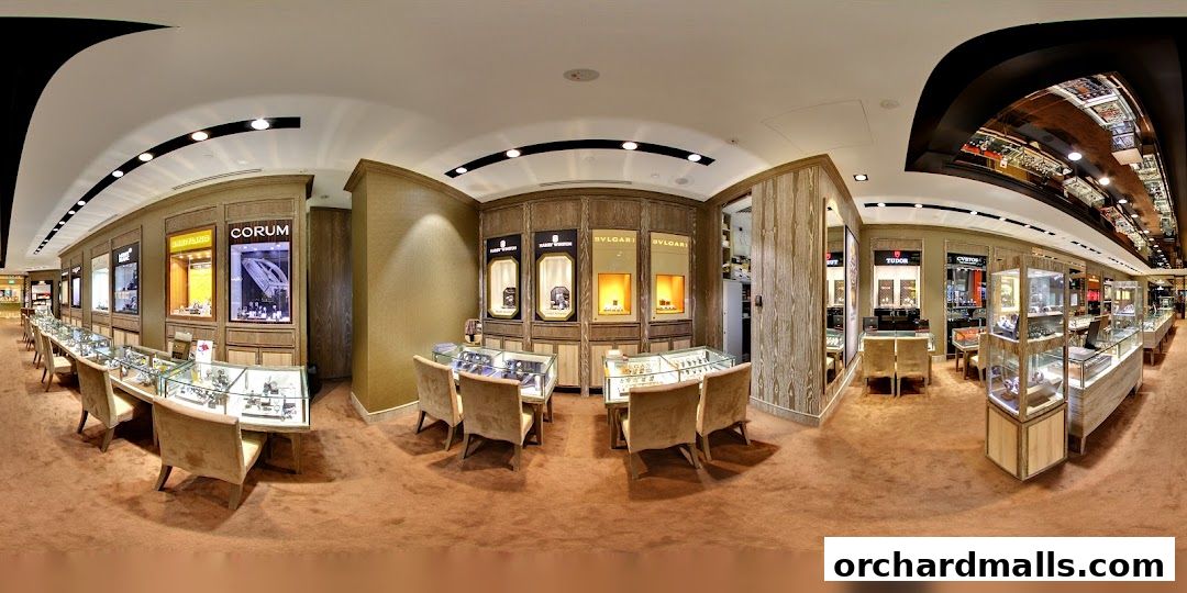Interior view of a luxury watch store with display cases and seating.