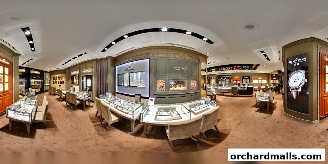 Interior view of a luxury watch store showcasing display cases and brand advertisements.